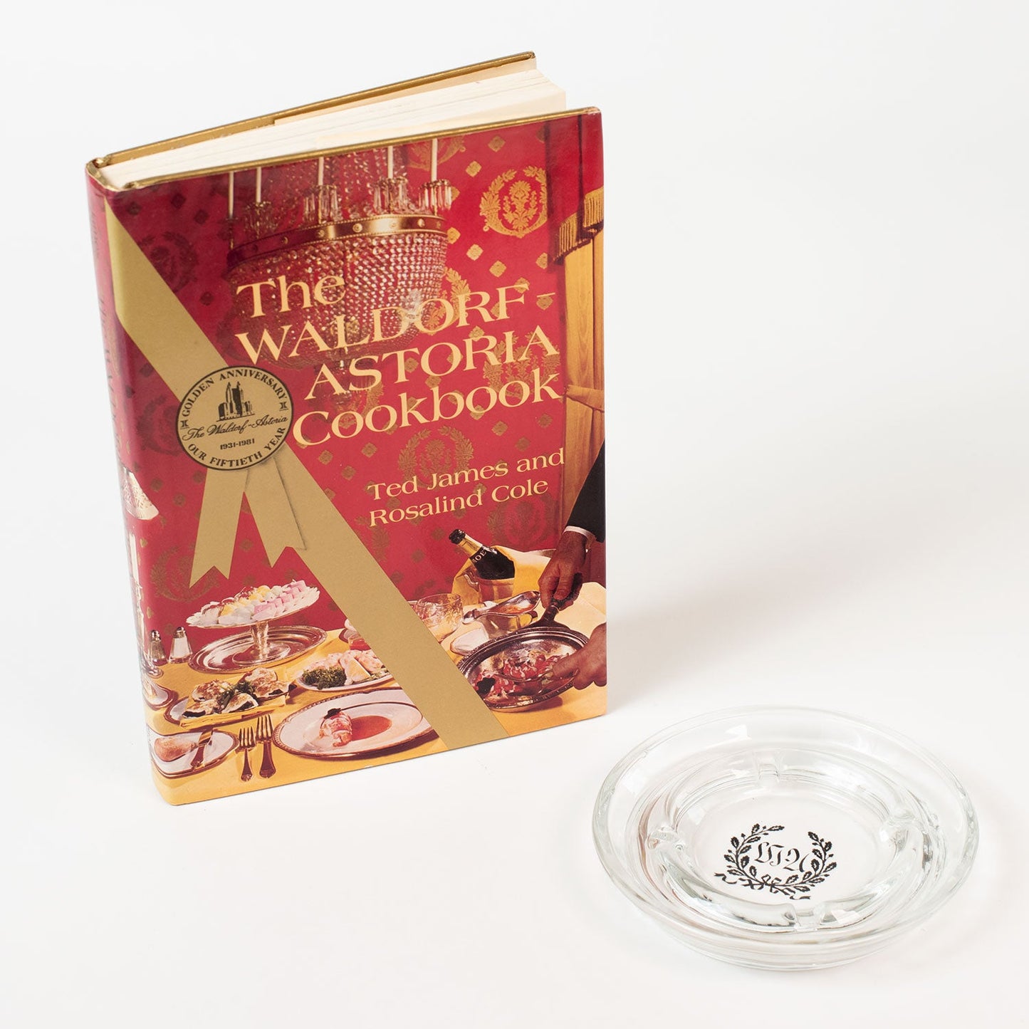 HISTORY COMPANY - Original Waldorf-Astoria Hotel Ashtray plus a rare First Edition of 'The Waldorf-Astoria Cookbook.' 